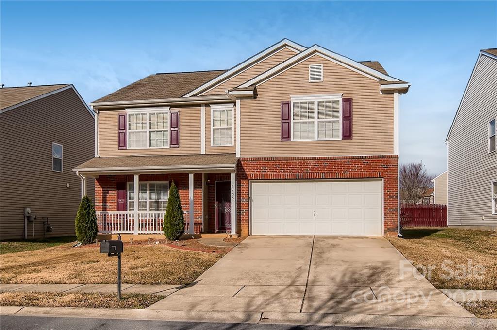 8735 Chalkstone Road Charlotte, NC 28216 - Photo 3 of 29 a front view of a house with a yard