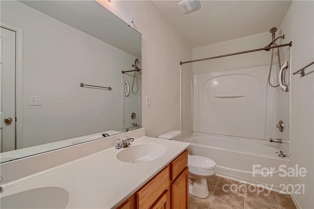 8735 Chalkstone Road Charlotte, NC 28216 - Photo 21 of 29 a bathroom with a sink toilet and shower