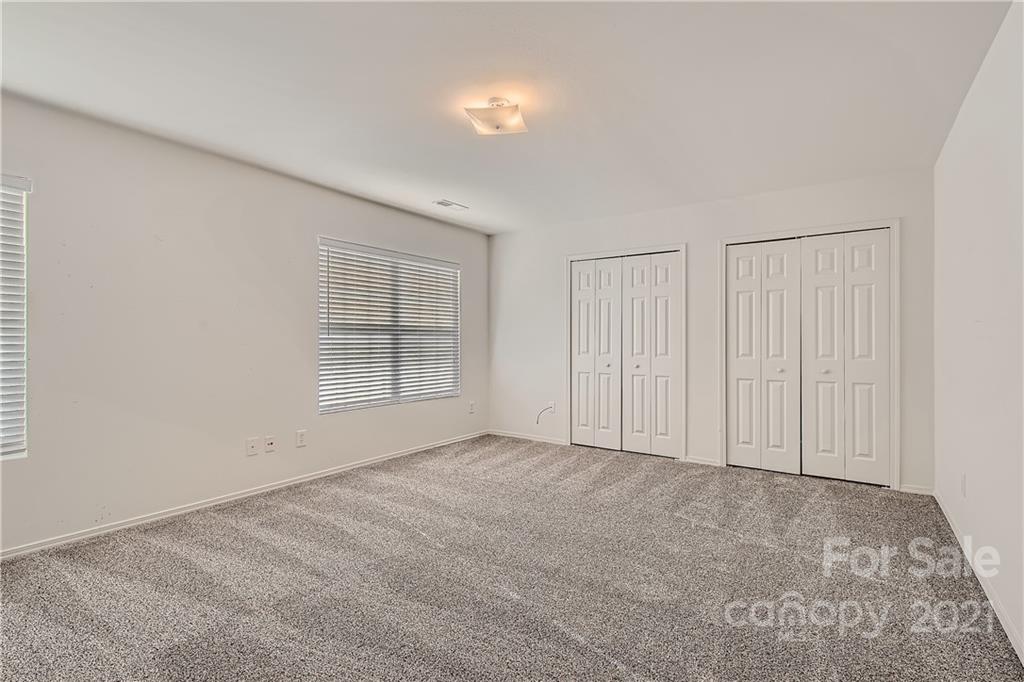 8735 Chalkstone Road Charlotte, NC 28216 - Photo 22 of 29 a view of an empty room with a window