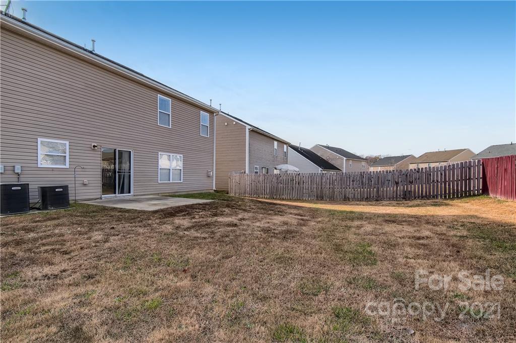 8735 Chalkstone Road Charlotte, NC 28216 - Photo 28 of 29 a view of an house with backyard space and balcony
