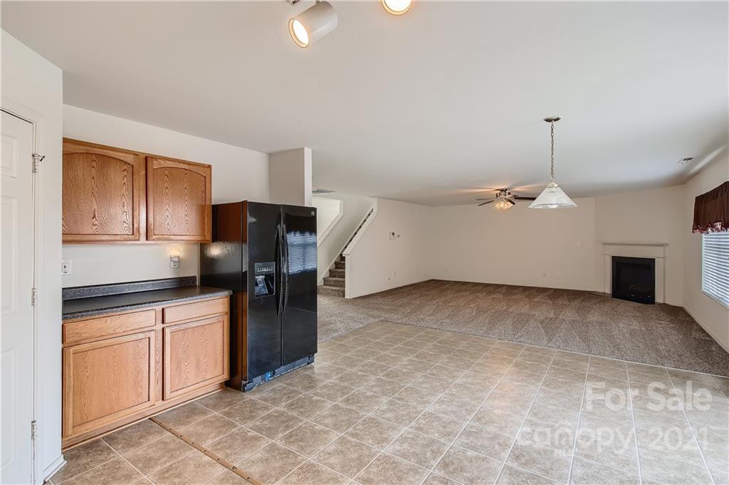 8735 Chalkstone Road Charlotte, NC 28216 - Photo 10 of 29 a kitchen with stainless steel appliances granite countertop a refrigerator and a stove top oven