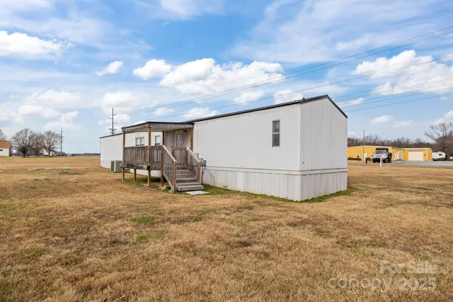 an aerial view of a house with outdoor space