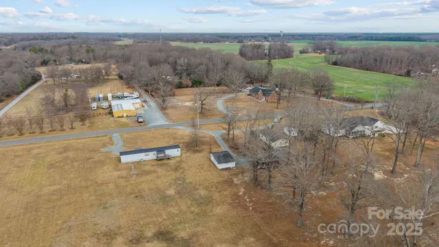 an aerial view of a house with outdoor space