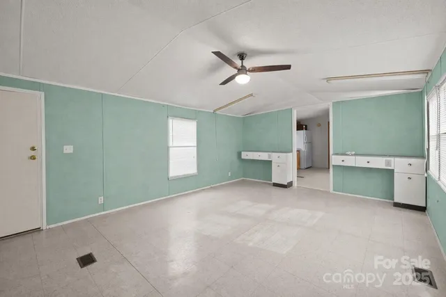 a view of an empty room with a bathroom