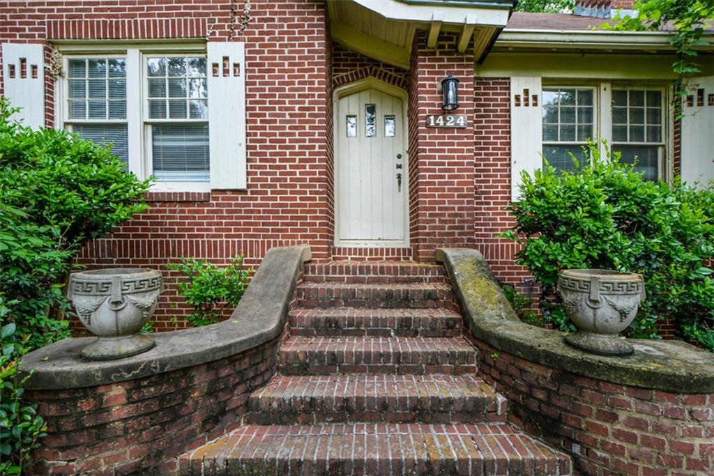 1424 Emory Road Northeast Atlanta, GA 30306 - Photo 5 of 36 a front view of a house with a garden