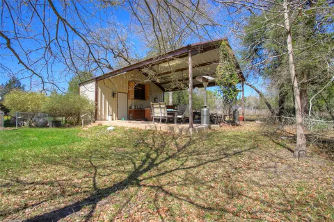 a backyard of a house with lots of green space