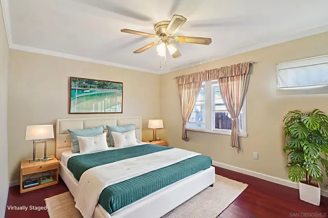 a bedroom with a large bed and a window