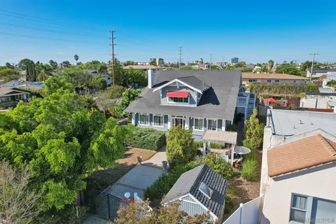a view of a houses with a yard and plants