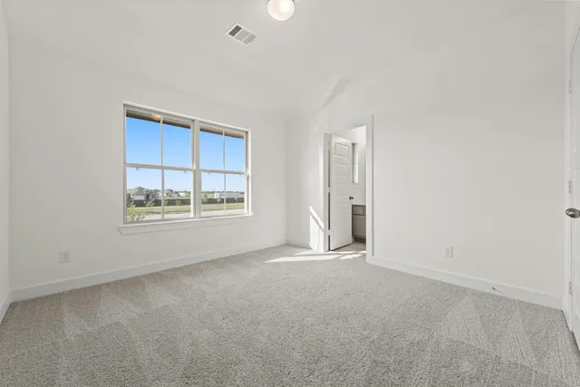 a view of a hallway with windows