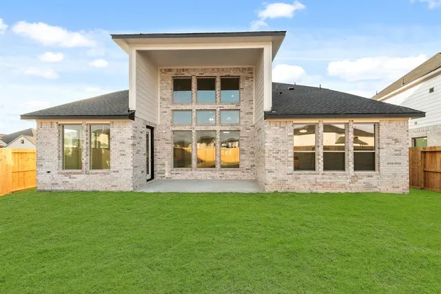 an aerial view of a house with outdoor space and street view