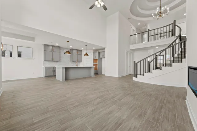 a kitchen with kitchen island a sink stainless steel appliances and cabinets
