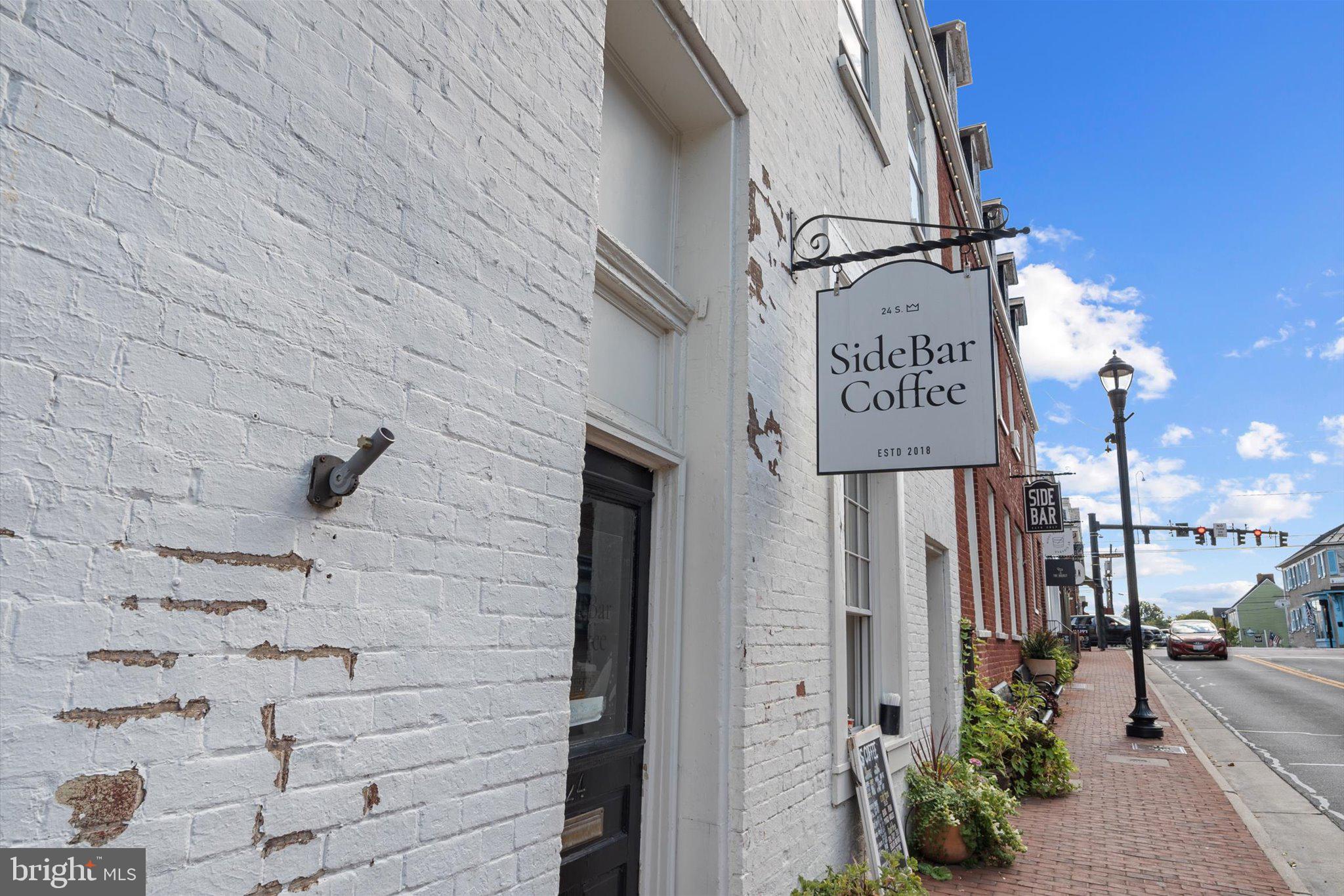 503 Sunset View Terrace Southeast, Unit 101 Leesburg, VA 20175 - Photo 38 of 39 Charming cafe on a sunny street.