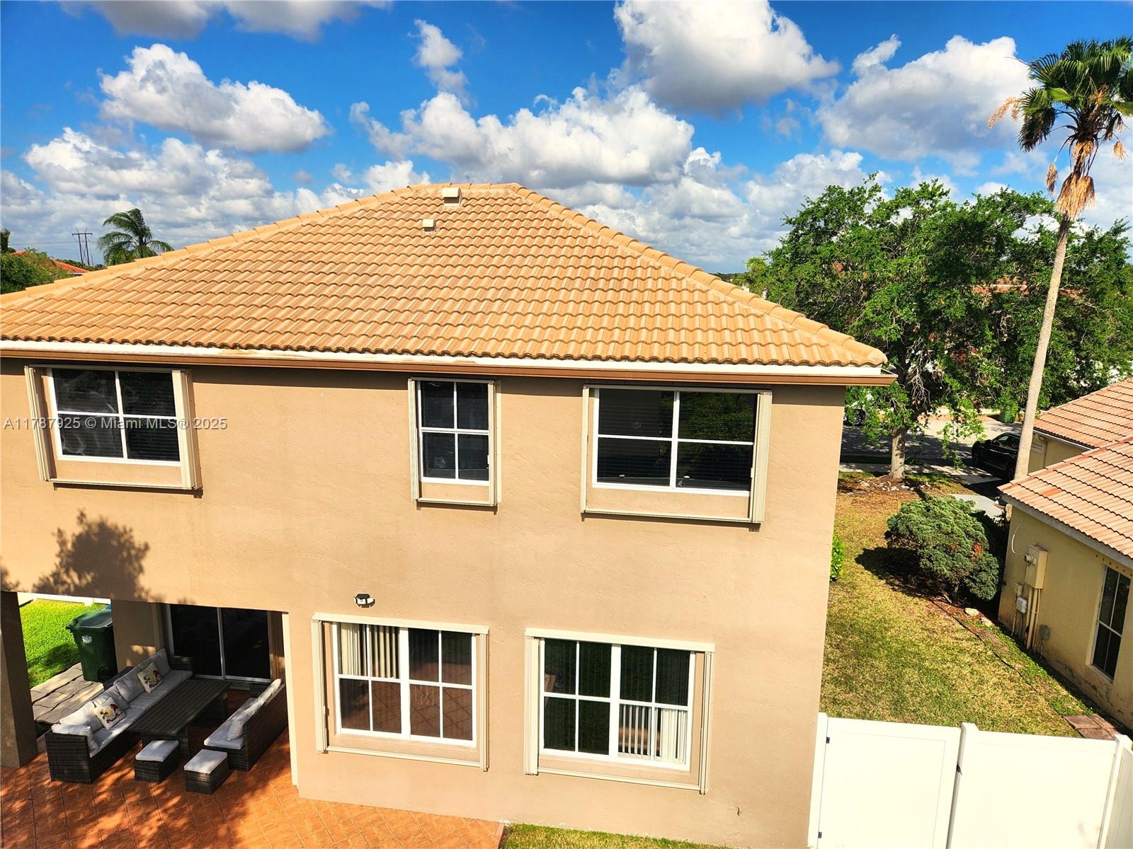785 Falling Water Road Weston, FL 33326 - Photo 11 of 45 a front view of a house with a yard