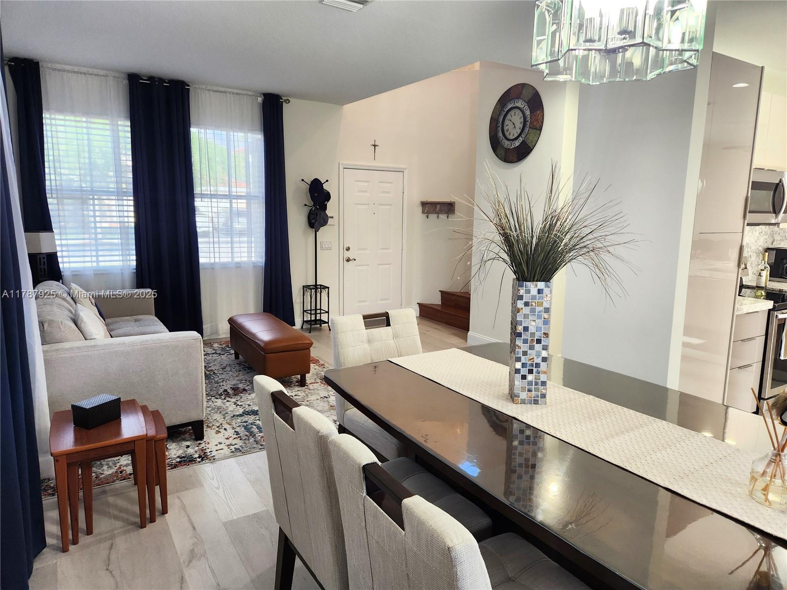 785 Falling Water Road Weston, FL 33326 - Photo 14 of 45 a living room with furniture and a large window