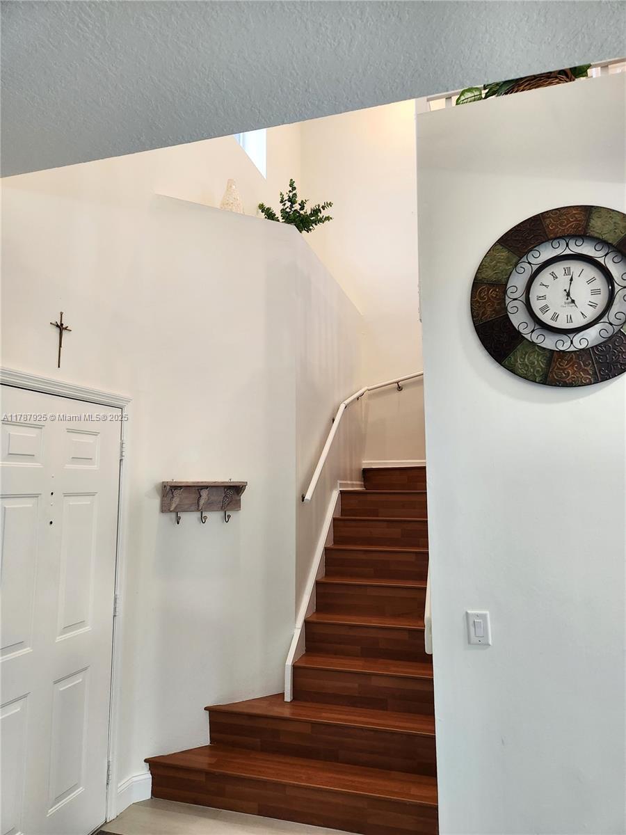 785 Falling Water Road Weston, FL 33326 - Photo 23 of 45 a view of a hallway with staircase