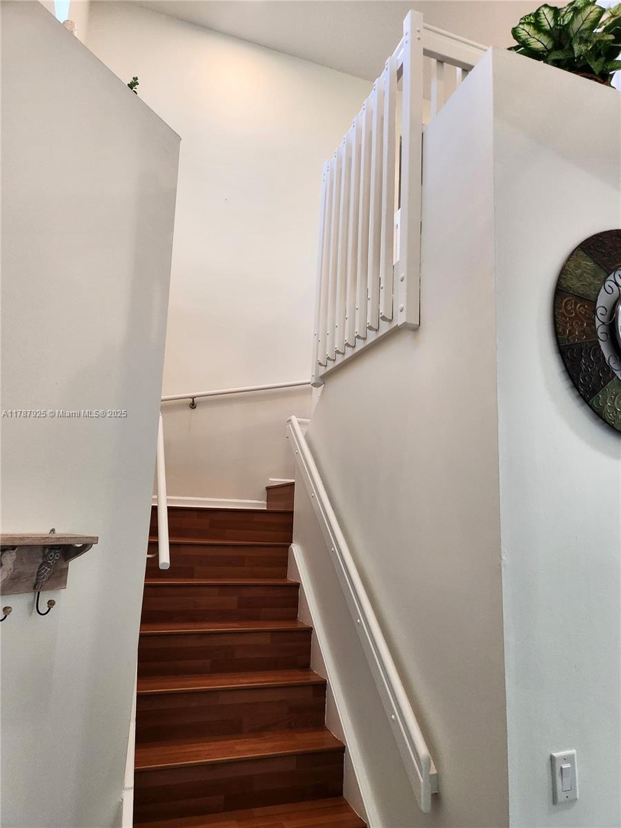 785 Falling Water Road Weston, FL 33326 - Photo 24 of 45 a view of entryway with wooden floor