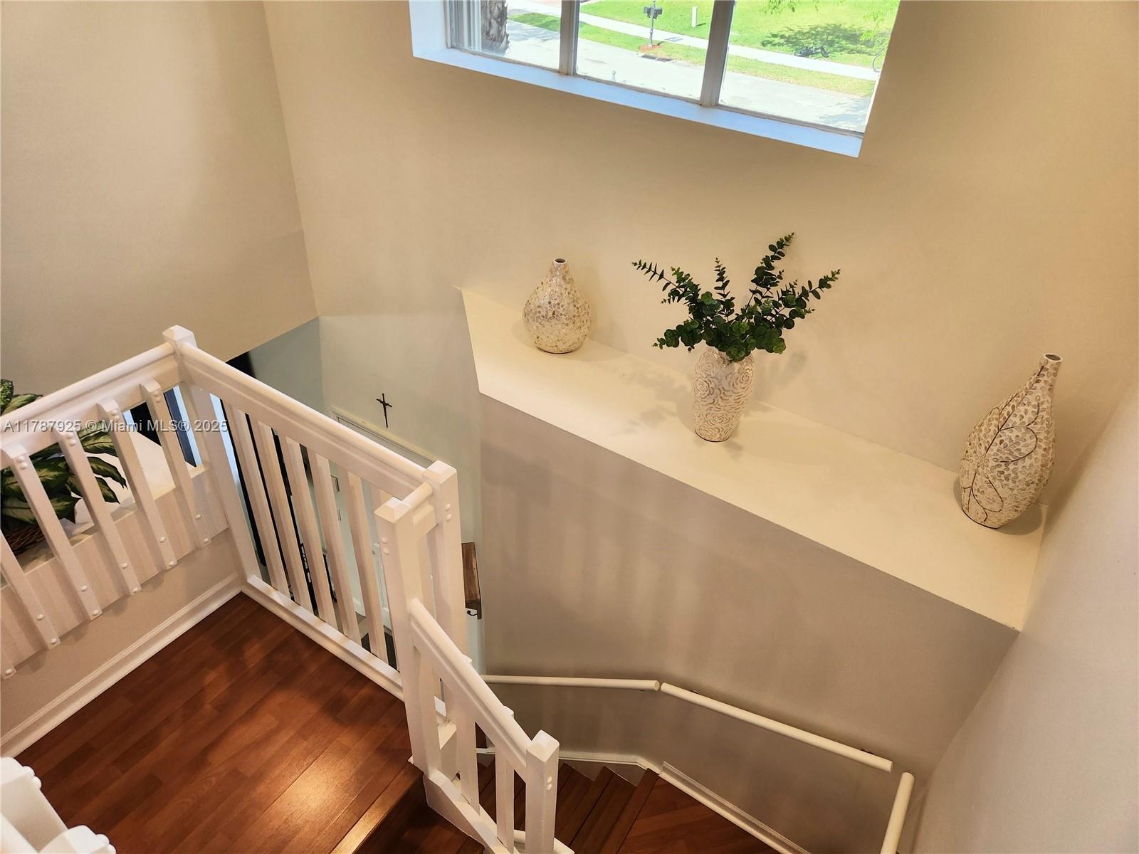 785 Falling Water Road Weston, FL 33326 - Photo 25 of 45 a view of staircase with white walls
