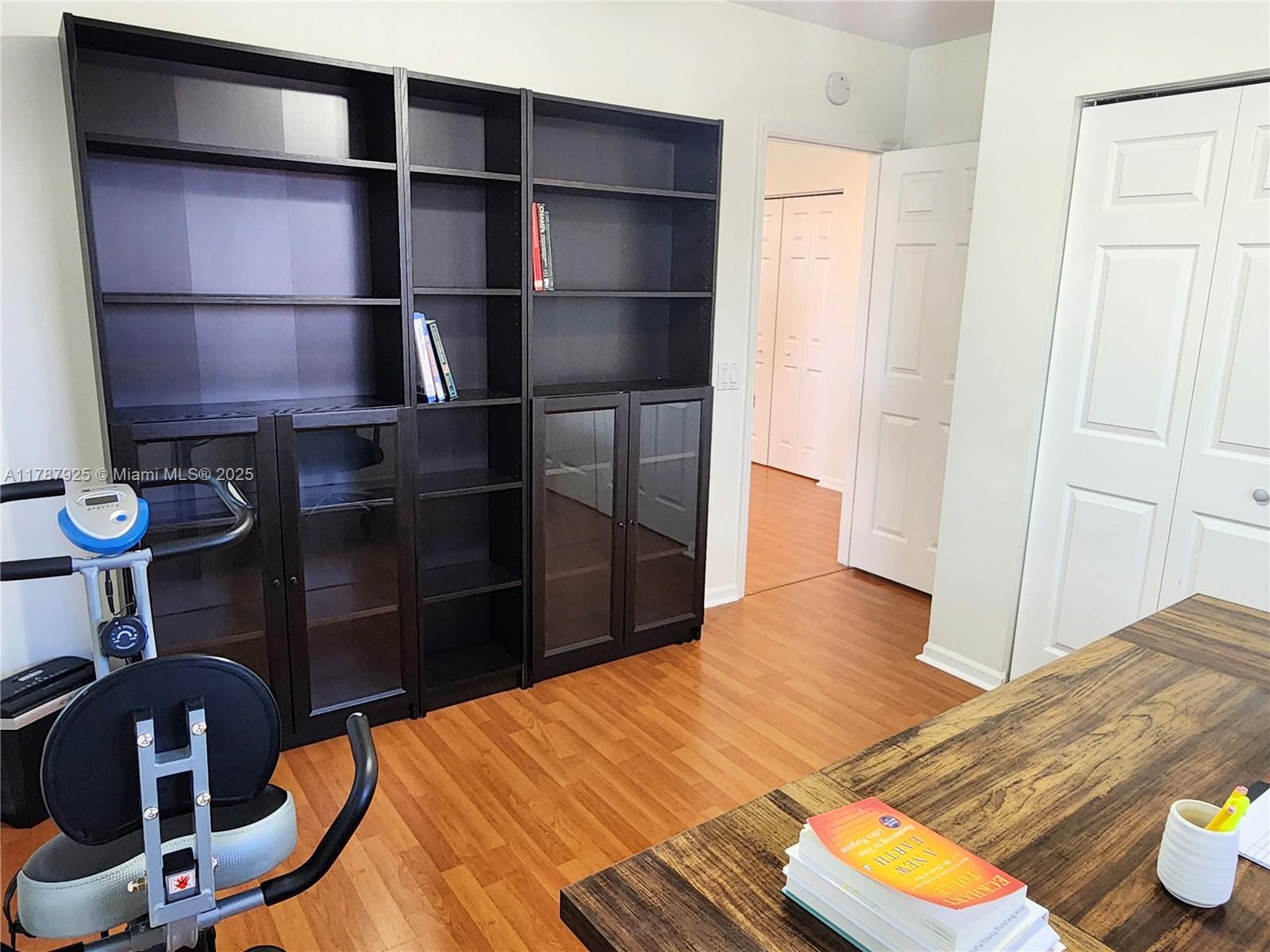 785 Falling Water Road Weston, FL 33326 - Photo 27 of 45 a bedroom with a bed and cabinets