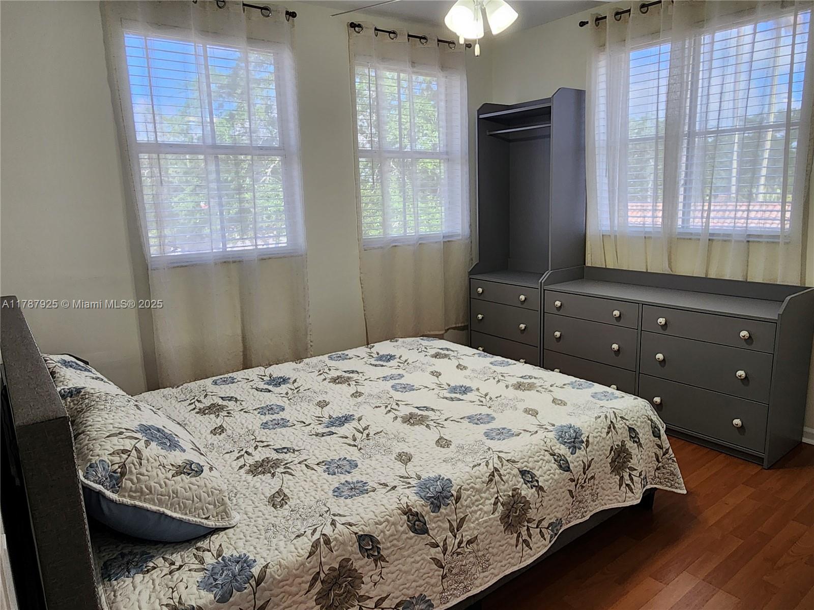 785 Falling Water Road Weston, FL 33326 - Photo 28 of 45 a bedroom with a bed and a window