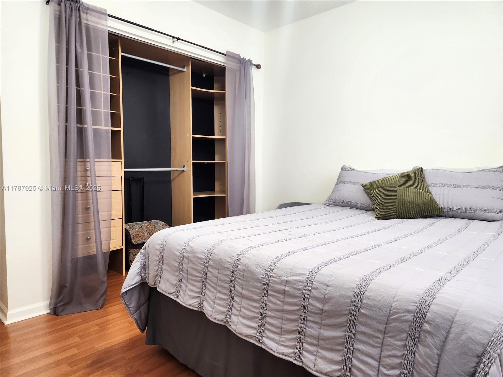 785 Falling Water Road Weston, FL 33326 - Photo 32 of 45 a bedroom with a bed and a window