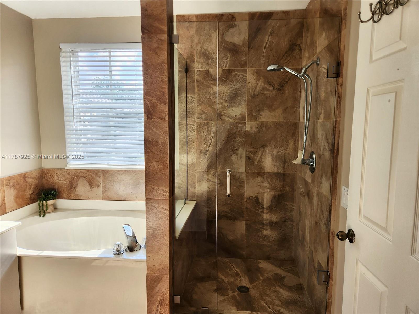 785 Falling Water Road Weston, FL 33326 - Photo 36 of 45 a bathroom with a sink and a shower
