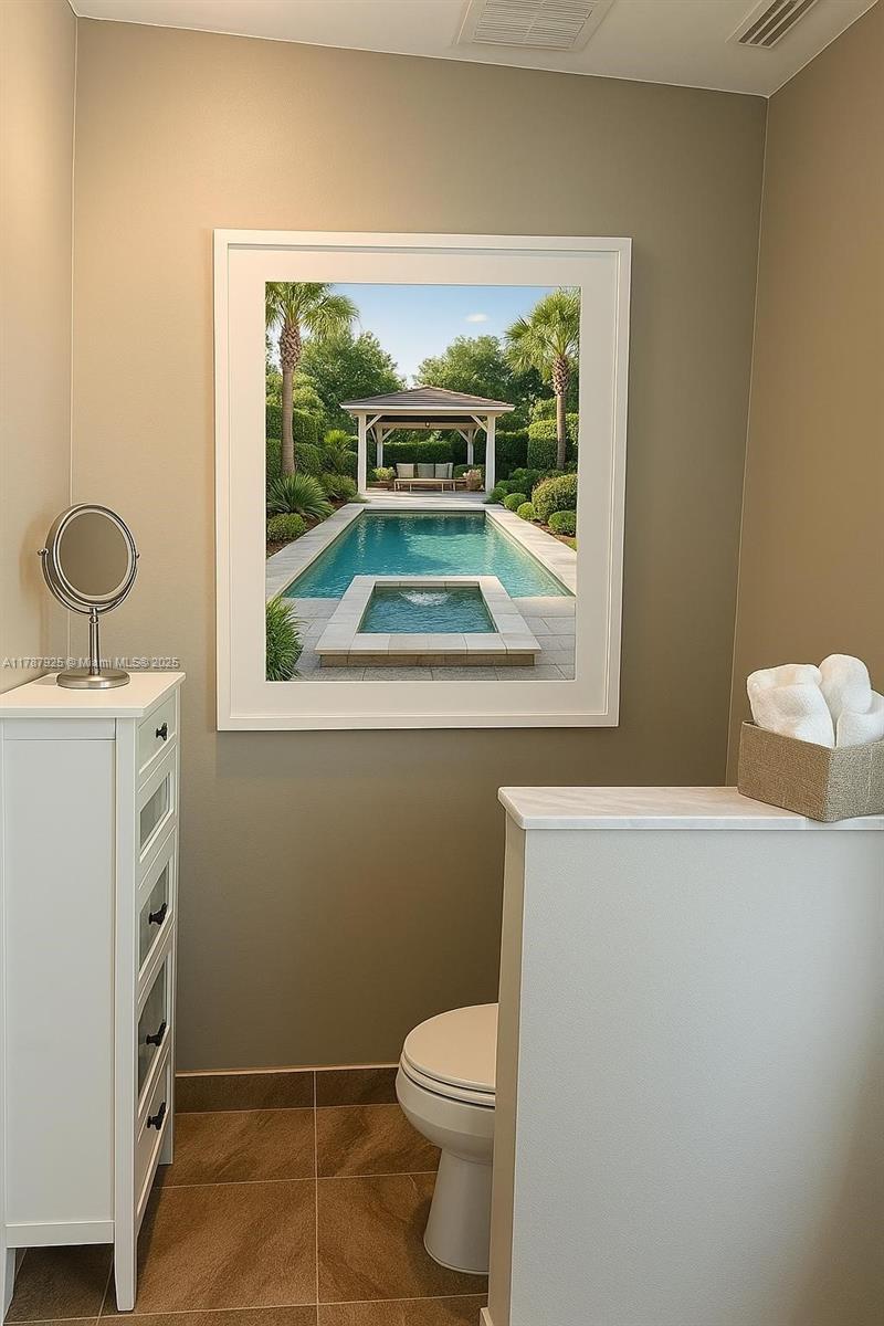 785 Falling Water Road Weston, FL 33326 - Photo 37 of 45 a bathroom with a toilet sink and window