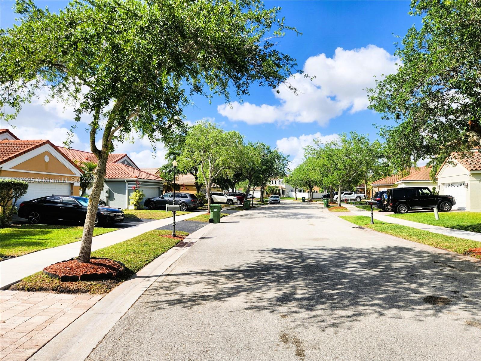 785 Falling Water Road Weston, FL 33326 - Photo 4 of 45 a view of street with houses