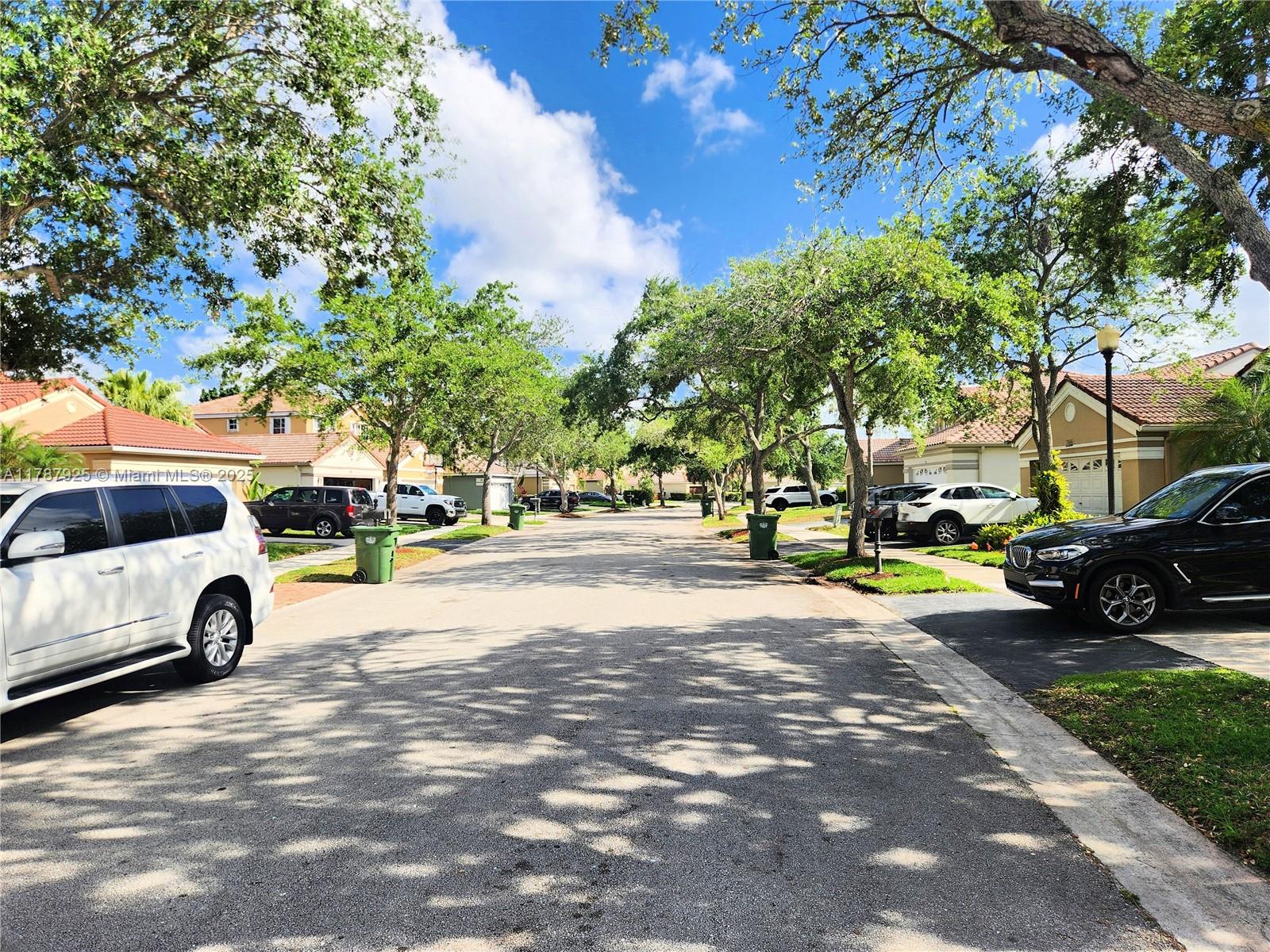 785 Falling Water Road Weston, FL 33326 - Photo 5 of 45 a view of street with parked cars