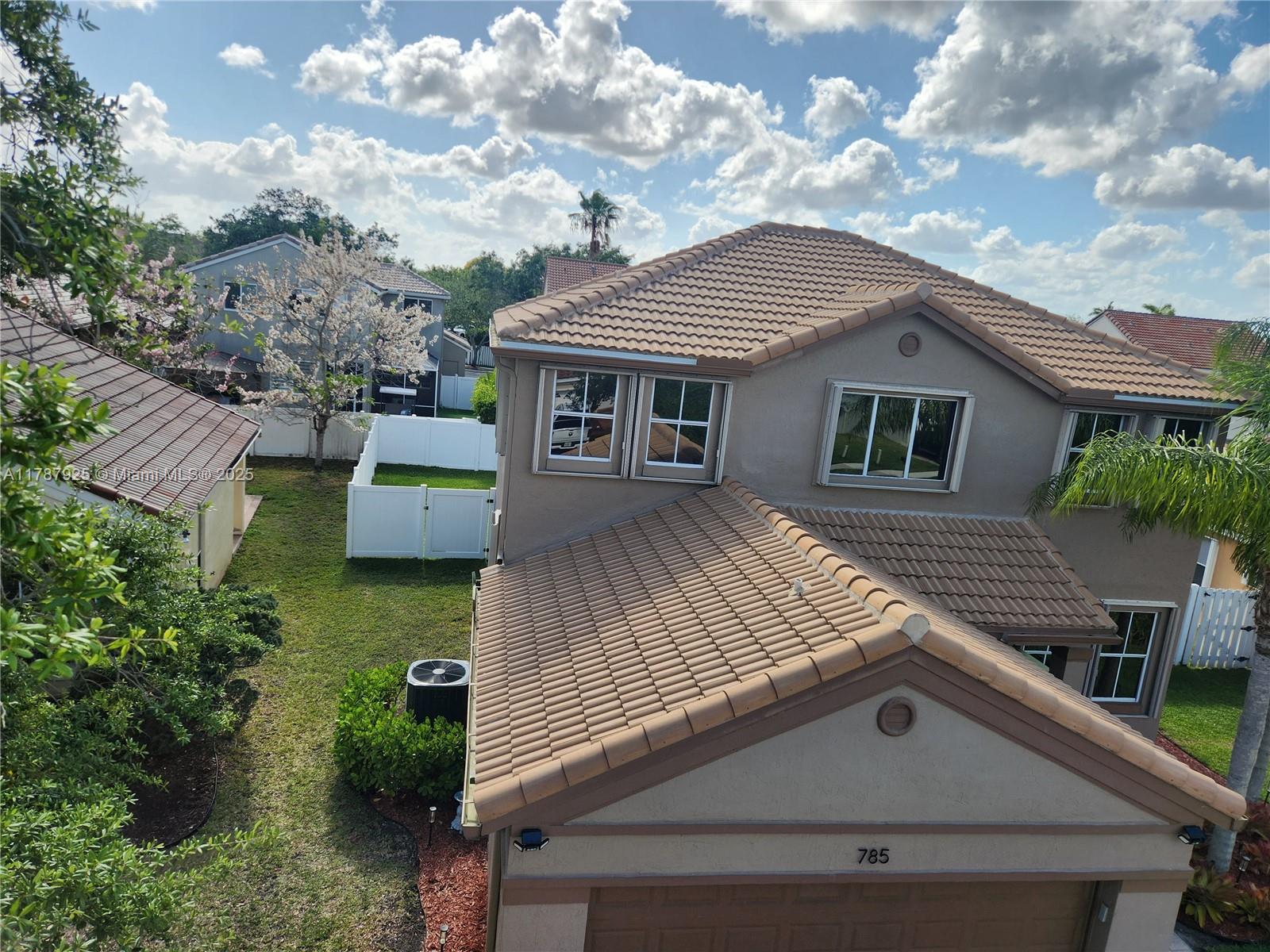 785 Falling Water Road Weston, FL 33326 - Photo 6 of 45 a view of house with outdoor space