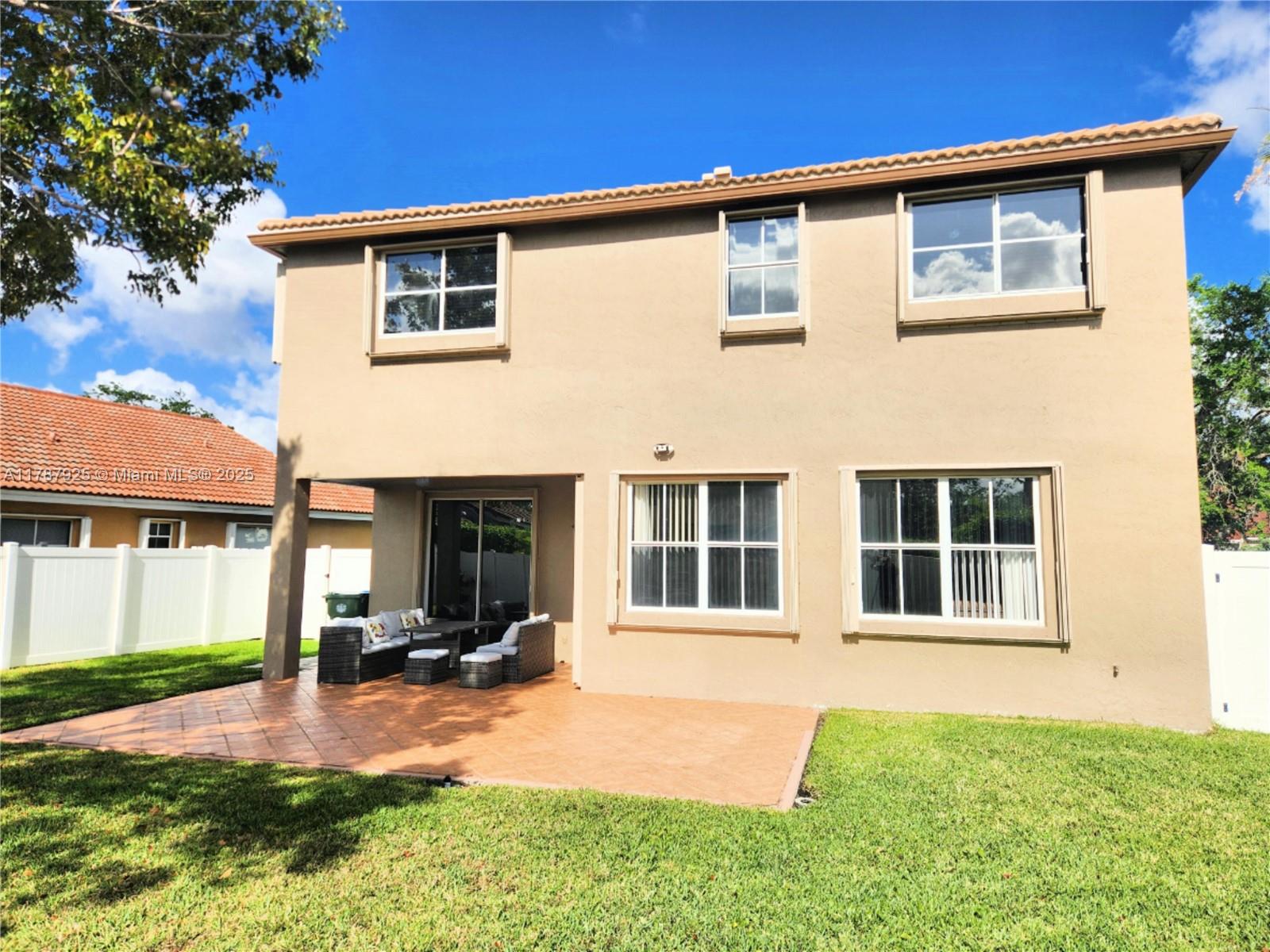 785 Falling Water Road Weston, FL 33326 - Photo 8 of 45 a view of a house with backyard and porch