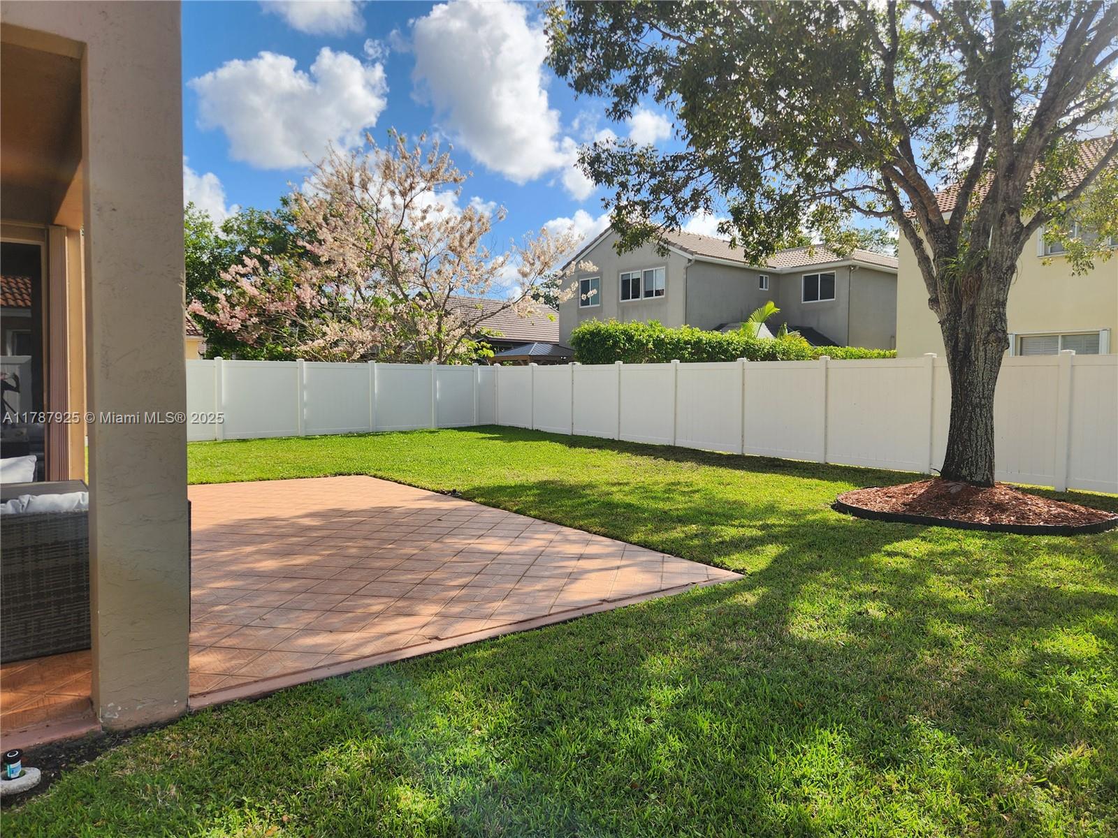 785 Falling Water Road Weston, FL 33326 - Photo 10 of 45 a view of a yard with a tree