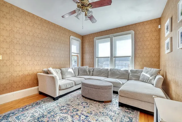 a living room with furniture and a rug