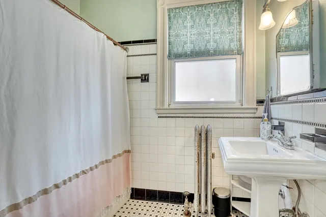 a view of an entryway with wooden floor and door