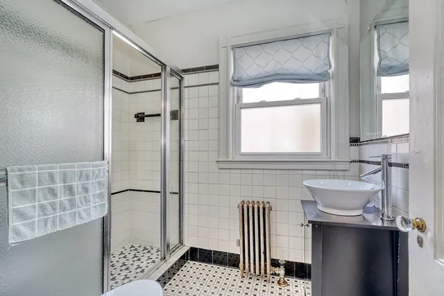 a kitchen with a sink dishwasher and cabinets