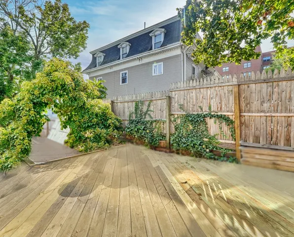 a view of an outdoor space with a table and chairs