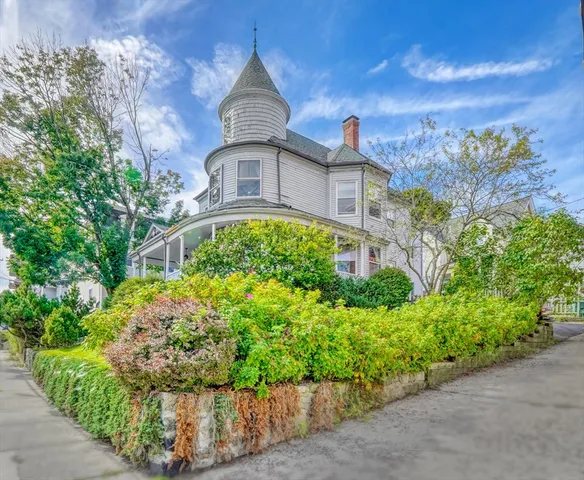 a view of a car parked in front of a house