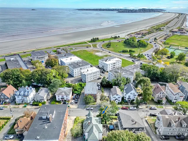 a view of a swimming pool with a yard