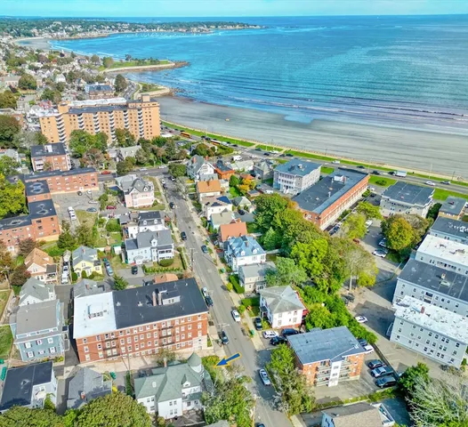 a view of a swimming pool with a yard