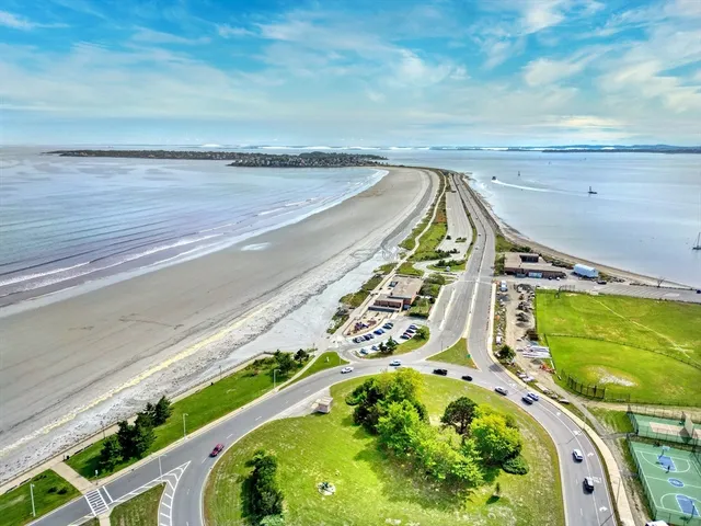 a view of a swimming pool with an ocean view