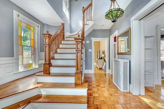a living room with furniture and a kitchen view