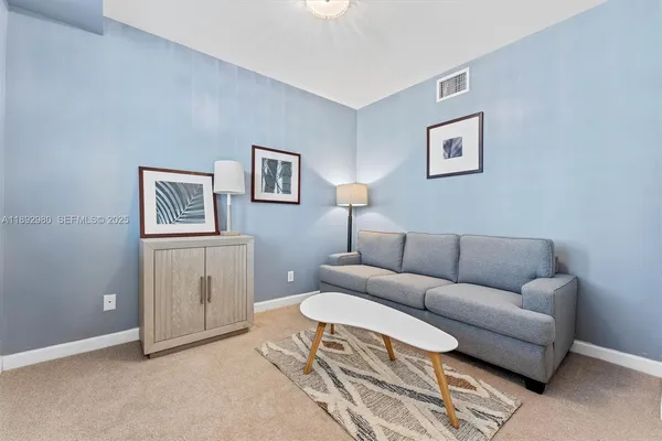 a living room with furniture and a area