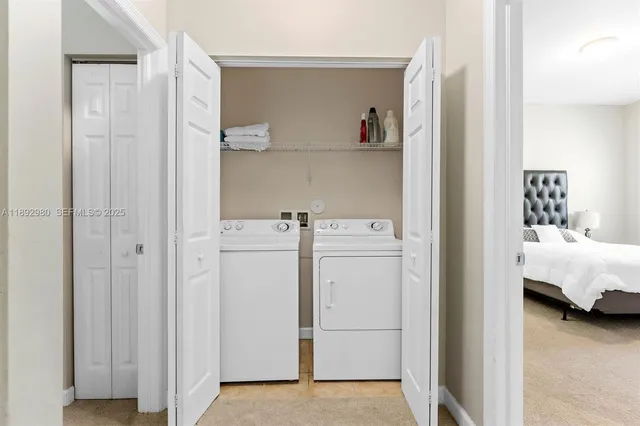 a utility room with dryer and washer