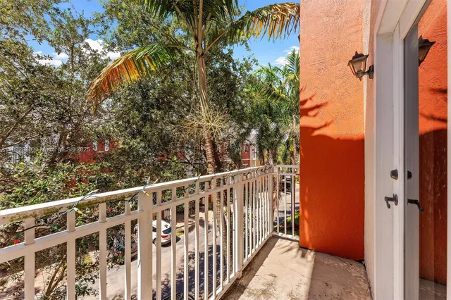 a view of a street from a balcony