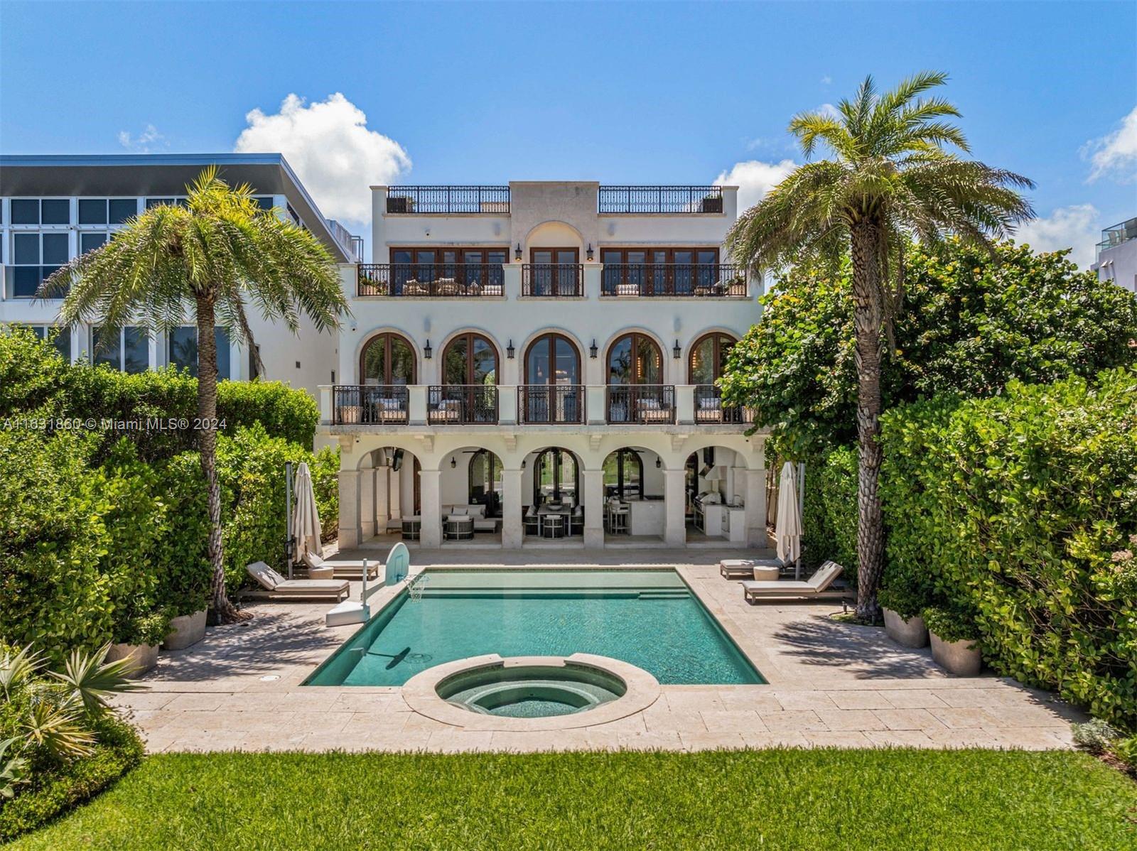 7825 Atlantic Way Miami Beach, FL 33141 - Photo 20 of 33 a view of a house with a swimming pool