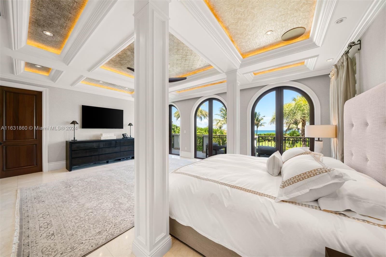 7825 Atlantic Way Miami Beach, FL 33141 - Photo 23 of 33 a living room with large window and a flat screen tv