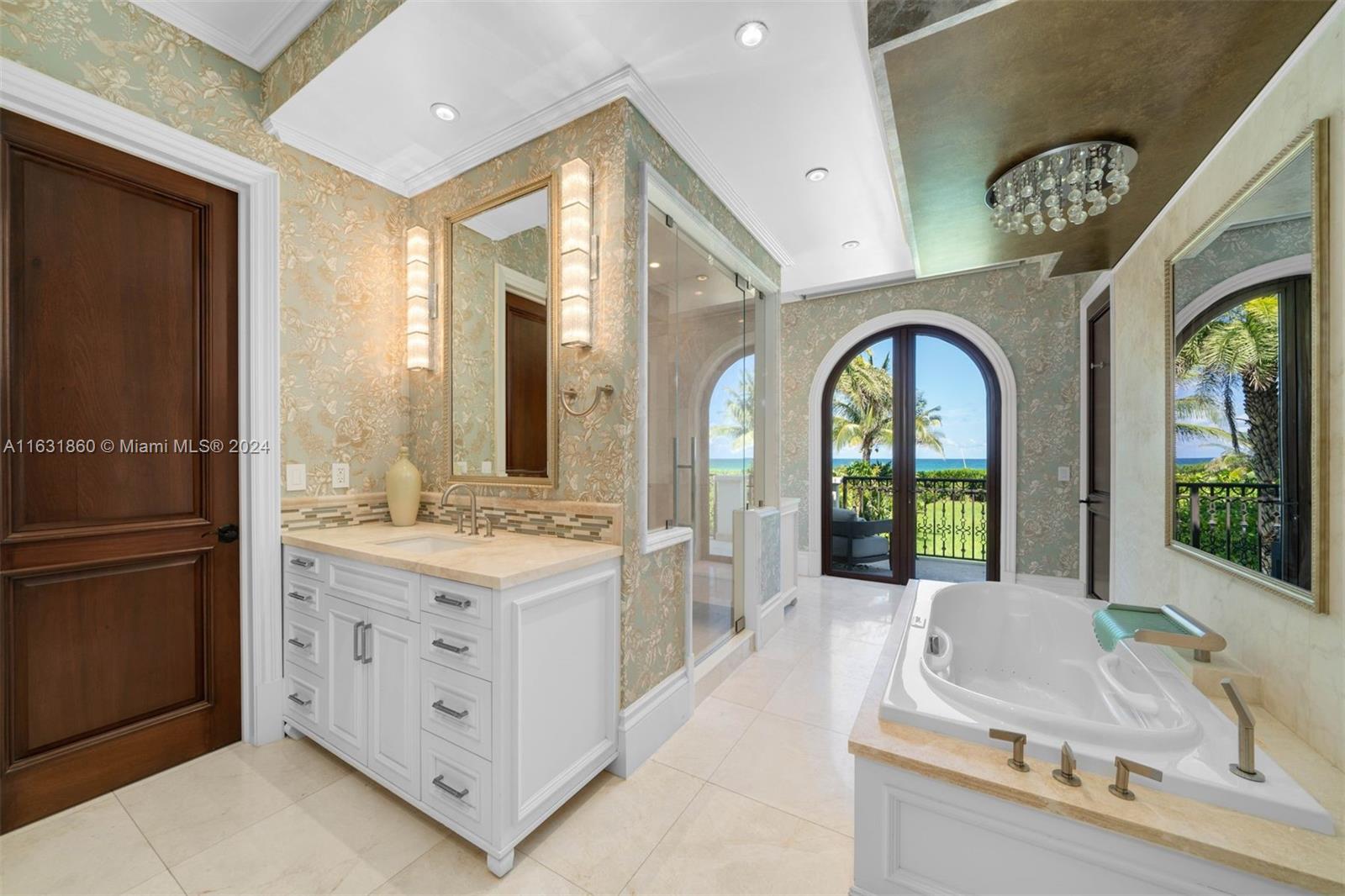 7825 Atlantic Way Miami Beach, FL 33141 - Photo 25 of 33 a large white kitchen with a large window