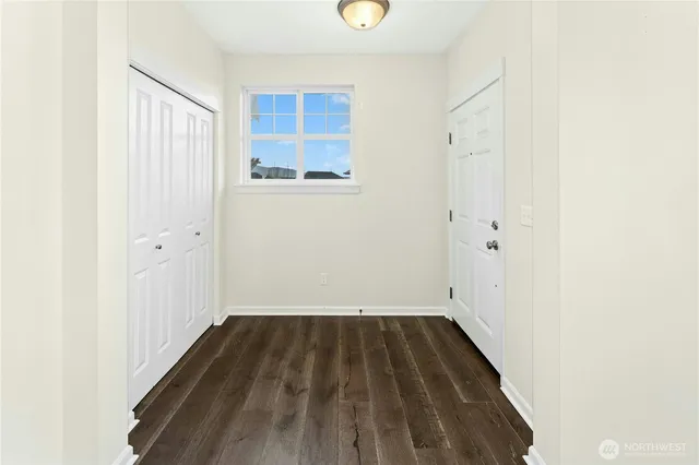 a view of a hardwood floor in a room