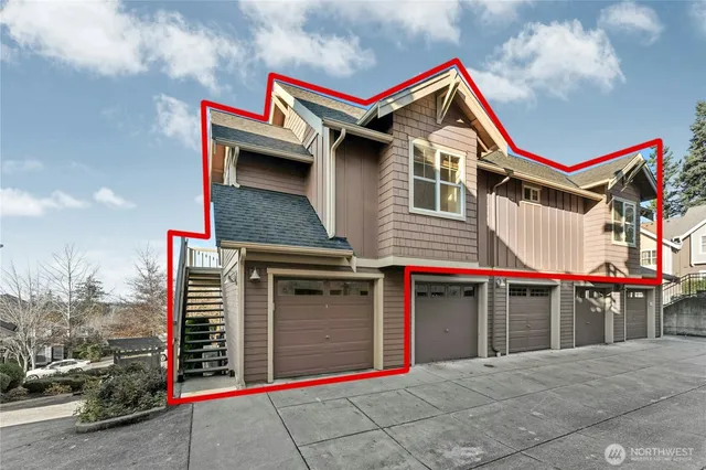 a front view of a house with a garage