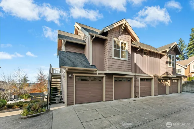 a front view of a house with a garage