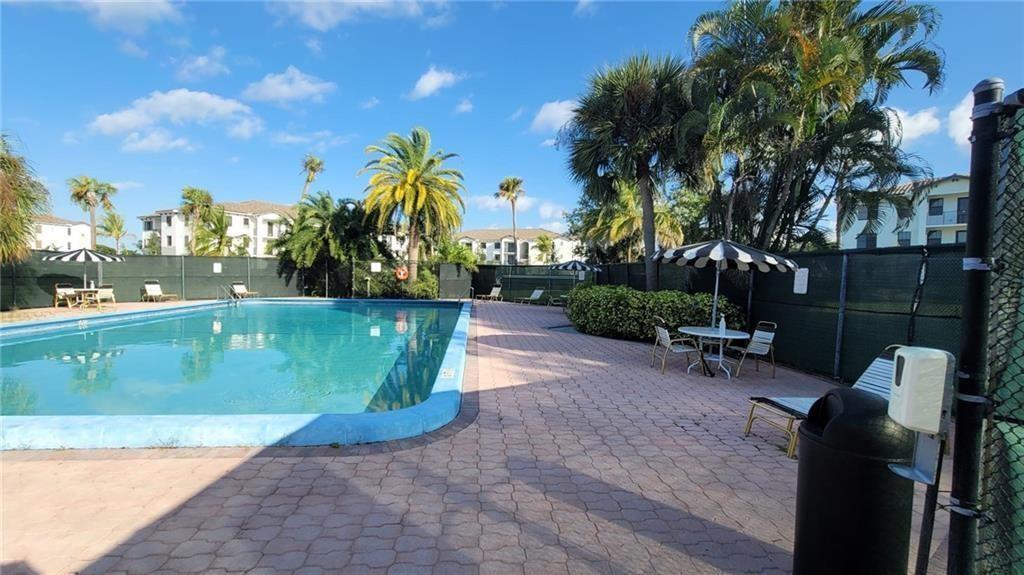 9273 Southwest 8th Street, Unit 109 Boca Raton, FL 33428 - Photo 15 of 22 a view of a backyard